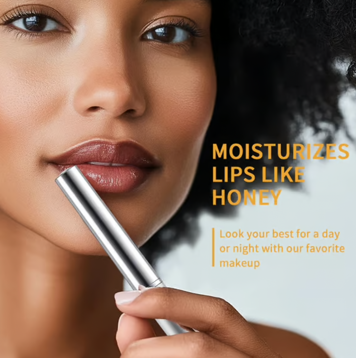 Universal nude shade lipstick with a balm-like texture, enhancing lips' natural tone.